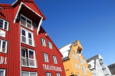 Converted warehouses along harbour front, Tromso, Troms, Norway, Scandinavia, Europe