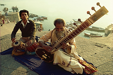 Sitar and tabla player beside the Ganga River, Varanasi, Uttar Pradesh state, India, Asia