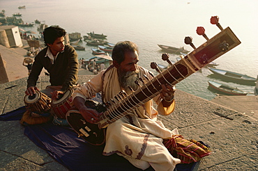 Sitar and tabla player beside the Ganga River, Varanasi, Uttar Pradesh state, India, Asia