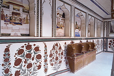 Narrow painted veranda with deep niches and carved stone chair assemblage, Kuchaman Fort, Rajasthan state, India, Asia