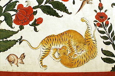 Detail of fighting tigers on painted dado in the Durbar Hall area of the palace, Samode Palace, Samode, Rajasthan state, India, Asia