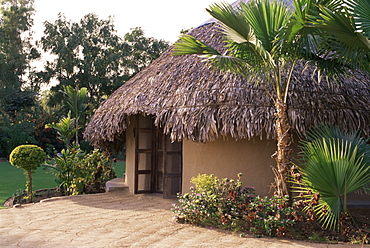 Modern residential home in traditional tribal Rabari round mud hut, Bunga style. near Ahmedabad, Gujarat state, India, Asia