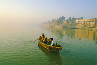 Waterfront and boat on the River Ganges (Ganga), Varanasi (Benares), Uttar Pradesh State, India