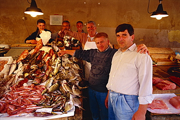 Fishermen in the Marsala fish market in Marsala on the island of Sicily, Italy, Europe