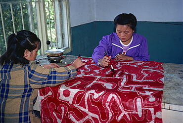 Applying wax during the making of batik cloth, Duyun, Guizhou, China, Asia