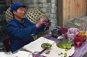 Man selling chemical dyes for domestic textile industry, Kaili, Guizhou, China, Asia