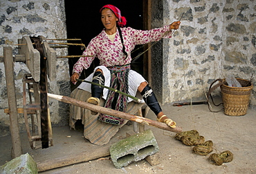 Woman twisting hemp, North Guangxi, China, Asia