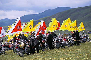 Tibetans using motorbikes instead of horses, festival, Qinghai Province, China, Asia