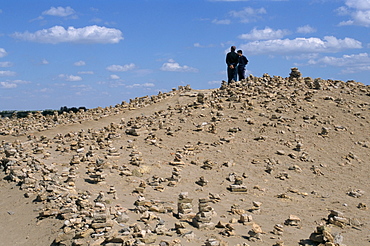 Piles of stone for good luck, Kunya Urgench, Turkmenistan, Central Asia, Asia