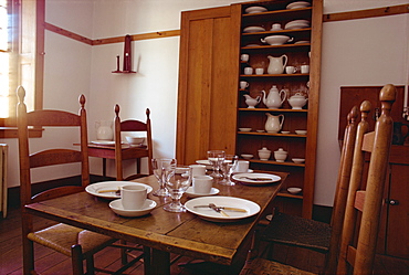 Interior with table, chairs, white china and cupboard in the Shaker Village of Hancock, Massachusetts, New England, United States of America, North America