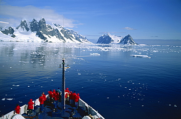 Tourists on the bow of a cruise ship off the Antarctic Peninsula, Antarctica, Polar Regions