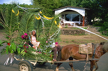 Bride and groom in wedding procession, Hanga Roa, Easter Island, Chile, South America