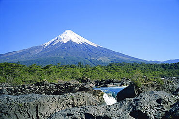 The cone of Volcan Osorno from the Petrohue Falls near Puerto Montt, Chile, South America