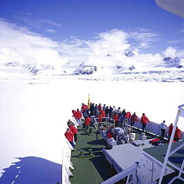 Tourists on deck of a cruise ship, sea ice cruising in fast ice, Antarctic Peninsula, Antarctica, Polar Regions