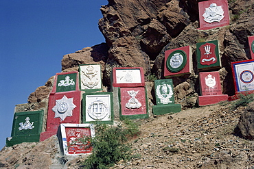 Regimental plaques on the mountain side in the Khyber Pass, N.W. Frontier, Pakistan, Asia