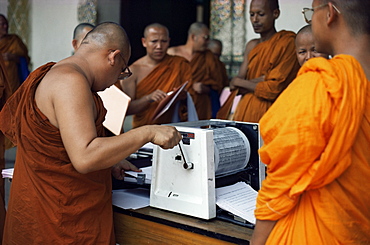 Buddhist monks using stencil machine, Lampoon, Thailand, Southeast Asia, Asia