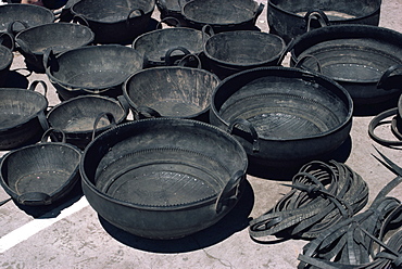 A selection of buckets made from recycled tyres for sale at Pujilo market in Ecuador, South America