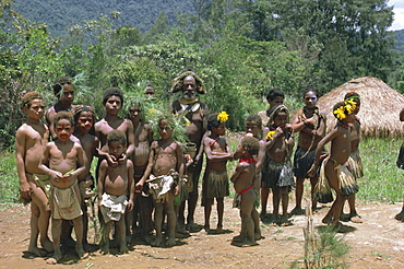 Portrait of a Huli man and group of children Highlands, Papua New Guinea, Pacific