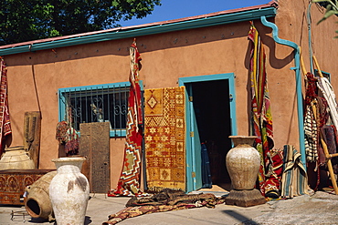 Assorted ethnic items on display outside shop, Guadalupe Street, Sante Fe, New Mexico, United States of America, North America