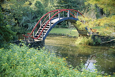 Arched bridge in Oriental American garden, Ballingrath Gardens, Mobile, Alabama, United States of America (U.S.A.), North America