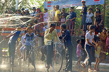 Crowds being sprayed with water during the Water Festival, Mandalay, Myanmar (Burma), Asia