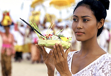 Girl with offerings at a reliqious ceremony in Bali, Indonesia, Southeast Asia, Asia