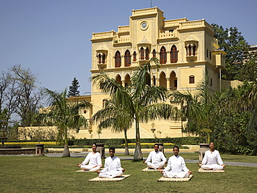 Yoga on the lawn in front of palace at Ananda in the Himalayas, India, Asia