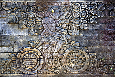 Stone relief portraying Dutch artist  W.O.J Nieuwenkamp who toured Bali by bicycle in 1904, on the temple of Meduwekarang, built in 1906, Bali, Indonesia, Southeast Asia, Asia