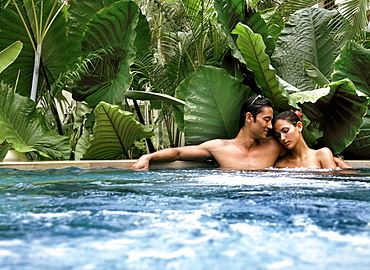 Couple in a jacuzzi, Maldives, Indian Ocean, Asia