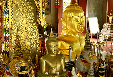 A golden Buddha image interred up to the chest, Wat Phra Thong, Phuket, Thailand, Southeast Asia, Asia