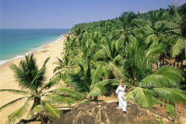 Beach and coconut palms, Kovalam, Kerala state, India, Asia