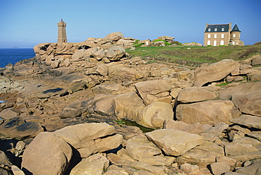 Rocks on the coast and the lighthouse at Ploumanach, on the Cote de Granit Rose, on the Cotes d'Amor, Brittany, France, Europe