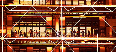 People standing on a balcony outside the Pompidou Centre, Paris, France