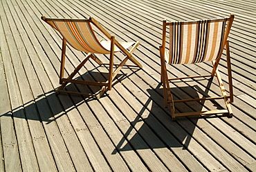 Deckchairs on the seafront boardwalk (la planche), Deauville, Cote Fleurie, Calvados, Normandy, France, Europe