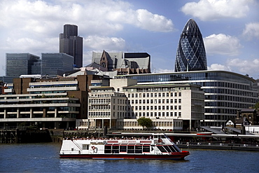 View across the River Thames to the City of London, with the Gherkin (Swiss Re Building) and Natwest Tower on skyline, London, England, United Kingdom, Europe