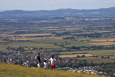 Family walking on Cleeve Hill, above Bishops Cleeve village, The Cotswolds, Gloucestershire, England, United Kingdom, Europe