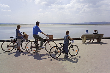 Family on bicycles, Le Crotoy, Somme Estuary, Picardy, France, Europe