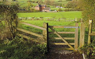 Stile and footpath with lock keepers house beyond, on the Worcester and Birmingham canal, Tardebigge, Worcestershire, England, United Kingdom, Europe