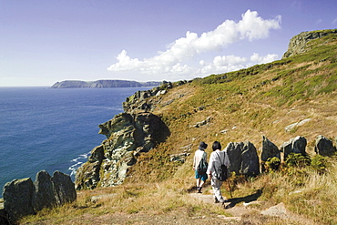 Walkers on the South West Devon Coast path, on National Trust land at Prawle Point, South Hams, Devon, England, United Kingdom, Europe