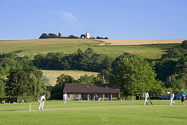 Cricket match and the Jack and Jill windmills at Clayton, seen from the South Downs Way, Sussex, England, United Kingdom, Europe