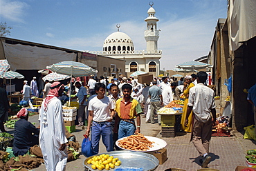 Vegetable souk with mosque behind, Abu Dhabi, United Arab Emirates, Middle East