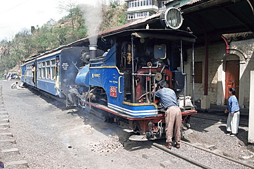 Toy train from Darjeeling to plains refuelling at Goom station, West Bengal state, India, Asia 