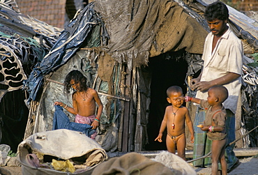 Family at front door of their rag shanty home, Kolkata (Calcutta), West Bengal, India, Asia