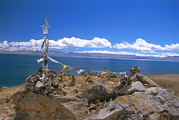 Prayer flags over sky burial site, Lake Manasarovar (Manasarowar), sacred lake just south of Kailas (Kailash), Tibet, China, Asia