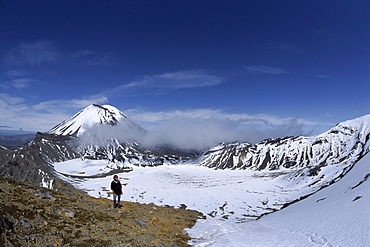 Late winter hiker on Tongariro Crossing, Mount Ngauruhoe and South Crater, Tongariro National Park, UNESCO World Heritage Site, Taupo, South Auckland, North Island, New Zealand, Pacific