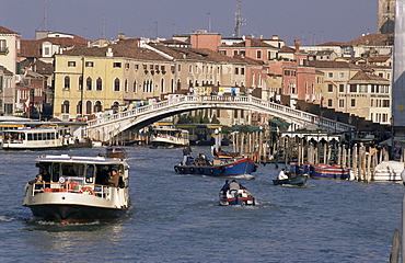 Vaporetto (water bus) on Grand Canal near the train station, with Scalzi Bridge, built in 1934, Venice, Veneto, Italy, Europe