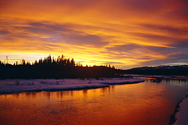 Sunset over a warm river in winter, Yellowstone National Park, Wyoming, USA