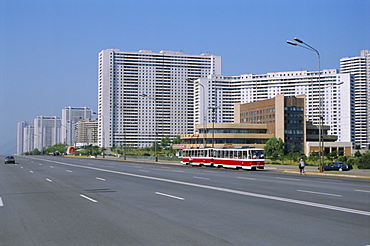 Blocks of flats beside road to Nampo, ten lanes wide but no traffic, Pyongyang, North Korea, Asia