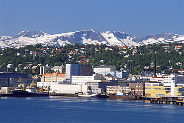 City known as Paris of the North, with snow on hills in June, Tromso, Norway, Scandinavia, Europe