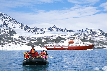 Tourists in zodiac from ice-breaker tour ship, Krossfjorden icebergs and glacier, Spitsbergen, Svalbard, Norway, Scandinavia, Europe